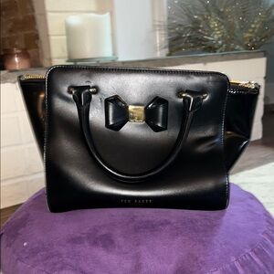 Ted Baker Black Satchel with Elegant Trapezoid Design